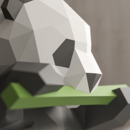 
Kreatywne puzzle 3D z papieru, panda jedząca bambus